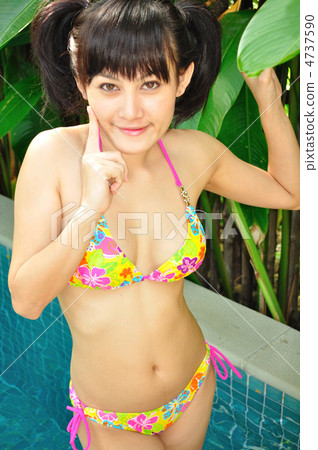 Young women in bikinis enjoying the resort 4737590