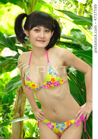 Young women in bikinis enjoying the resort 4737599