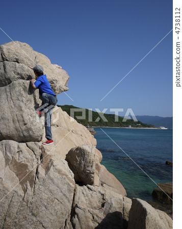 A man climbing a rock A man climbing a rock 4738112