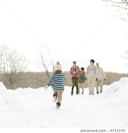 3 generations family walking on the snowy road 4753144