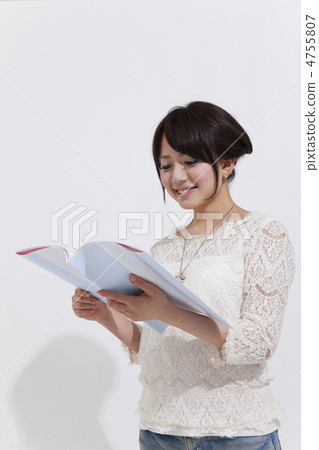 A woman reading a brochure 4755807