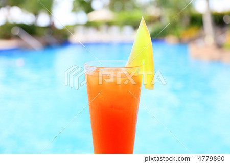 Drinking cocktail by the pool side Drinking cocktail by the pool side 4779860