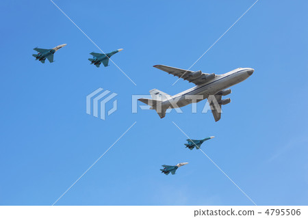 MOSCOW - MAY 9: An-124 plane accompanied by group of Su-27 fight MOSCOW - MAY 9: An-124 plane accompanied by group of Su-27 fight 4795506