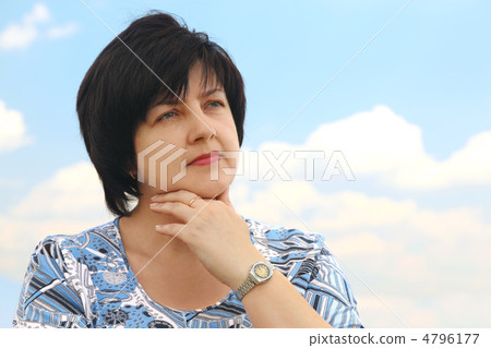portrait of brunette plumpy mature serious woman, hand on chin, 4796177