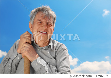 old senior in striped shirt with shove smiling and looking at ca old senior in striped shirt with shove smiling and looking at ca 4796194