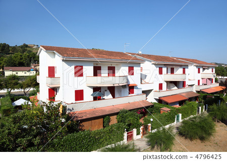 New white three-storeyed cottages with balconied and closed wind 4796425
