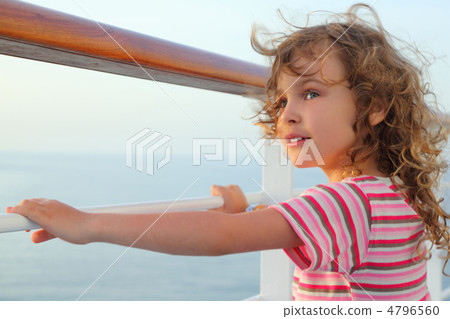 little curl girl standing on cruise liner deck, hands on rail, h little curl girl standing on cruise liner deck, hands on rail, h 4796560