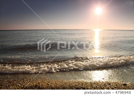 Marine wave froths and breaks over stony bank in morning at da Marine wave froths and breaks over stony bank in morning at da 4796948