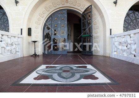 Entrance with  large arched glass door, decorated  forged colors 4797031