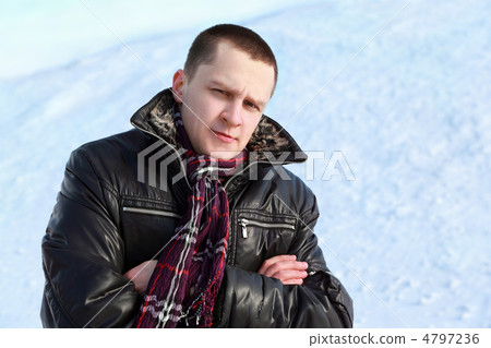 Student stands by winter day on snow and place arms on breast an Student stands by winter day on snow and place arms on breast an 4797236