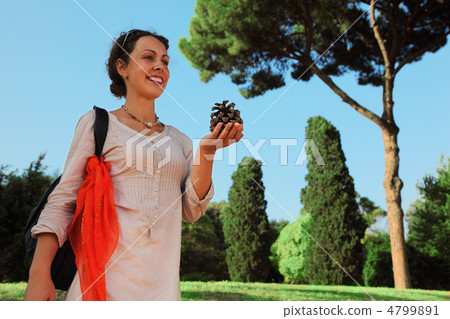 beautiful young woman in white blouse holding big cone and going beautiful young woman in white blouse holding big cone and going 4799891