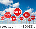 many stop signs on White, fluffy clouds in blue sky collage 4800331