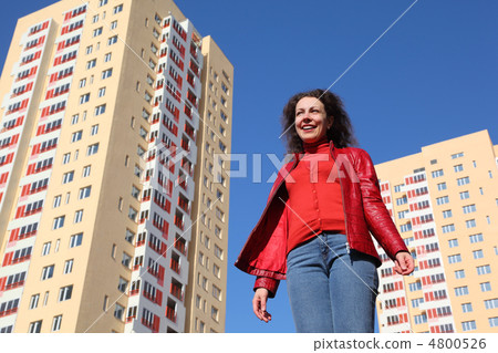 beautiful young woman in red jacket and blue jeans smiling, two beautiful young woman in red jacket and blue jeans smiling, two 4800526
