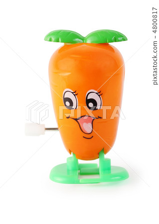 funny toy clockwork orange carrot with face on white background 4800817