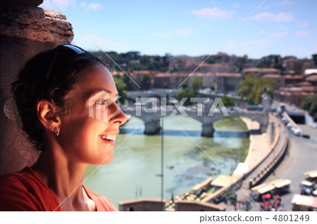 Young beautiful woman near window in Sant' Angelo Castel. View o Young beautiful woman near window in Sant' Angelo Castel. View o 4801249