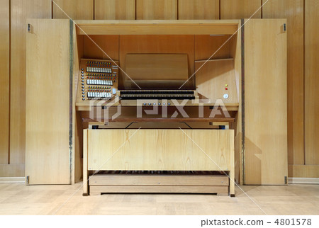 detail of wooden control panel of massive Pipe Organ; many keys detail of wooden control panel of massive Pipe Organ; many keys 4801578