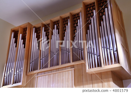 Detail look of large pipe organ; rows of beautiful metal pipes Detail look of large pipe organ; rows of beautiful metal pipes 4801579