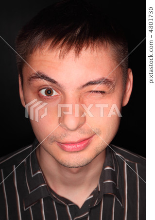 Handsome young man in striped black shirt portrait over black, m Handsome young man in striped black shirt portrait over black, m 4801730