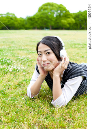 A woman listening to music A woman listening to music 4804664