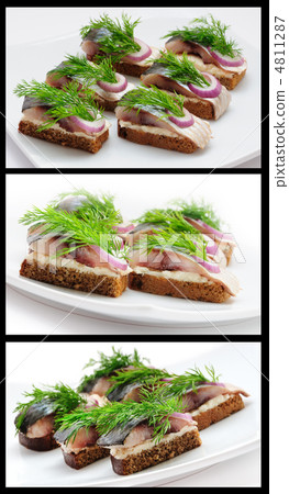 Sandwiches of rye bread with herring, onions and herbs. Sandwiches of rye bread with herring, onions and herbs. 4811287