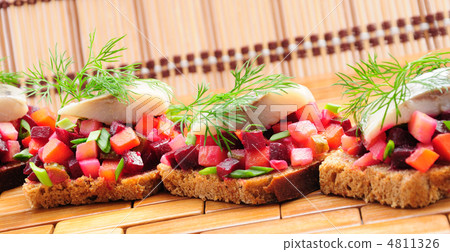 Sandwiches with rye bread, herring and vegetables Sandwiches with rye bread, herring and vegetables 4811326