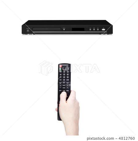 Remote control in the hand against dvd 4812760