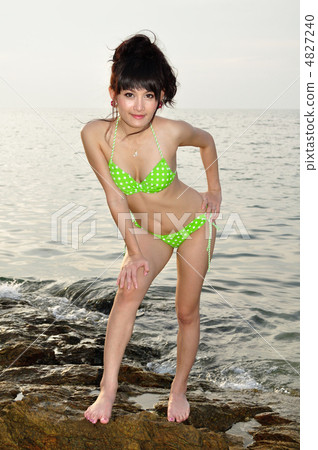 A young lady playing at the beach 4827240