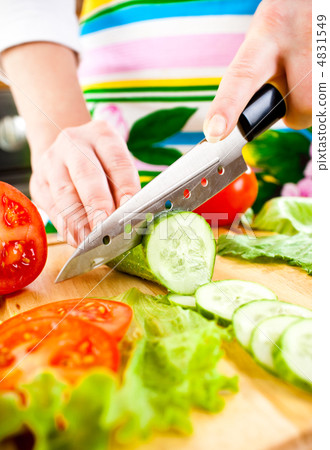 Woman's hands cutting vegetables Woman's hands cutting vegetables 4831549