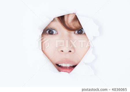 A woman looking through a hole 4836065