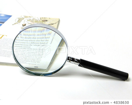 Foreign books and magnifying glass Foreign books and magnifying glass 4838630