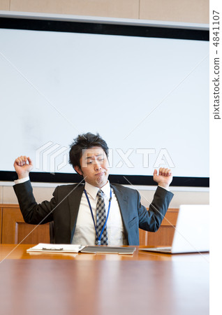 A salaryman who stretches while watching a notebook computer A salaryman who stretches while watching a notebook computer 4841107