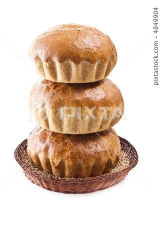 fresh baked rolls with grain in a basket on white 4849904