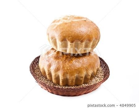 two fresh baked rolls with grain in a basket on white 4849905