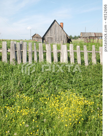 The old wooden house behind a fence 4852666