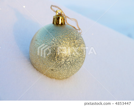 fur-tree sphere hangs on tree branch against snow 4853447