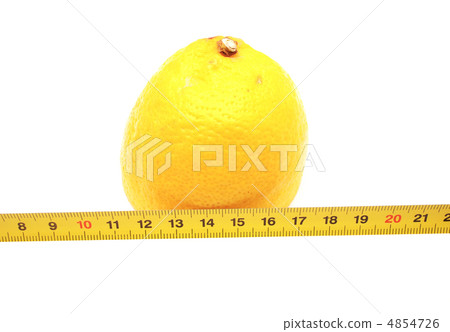 Lemon and a ruler on a white background Lemon and a ruler on a white background 4854726