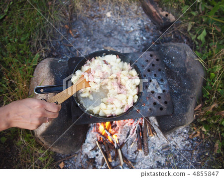 Outdoors cooked stew boiling on the fire Outdoors cooked stew boiling on the fire 4855847
