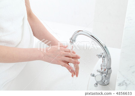 A woman washing her hands A woman washing her hands 4856633