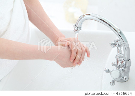A woman washing her hands A woman washing her hands 4856634