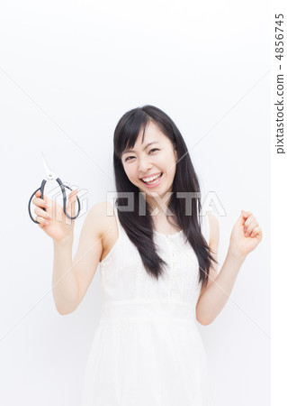 A woman with scissors 4856745