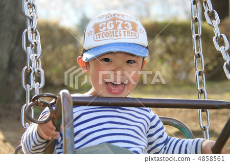 3 Year Old Child Playing With Swing Stock Photo 4858561