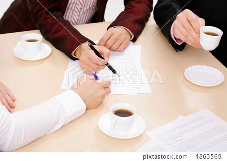 Businesspeople analyze documents 4863569