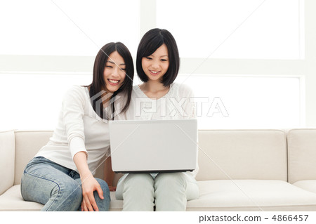 Women watching personal computers 4866457