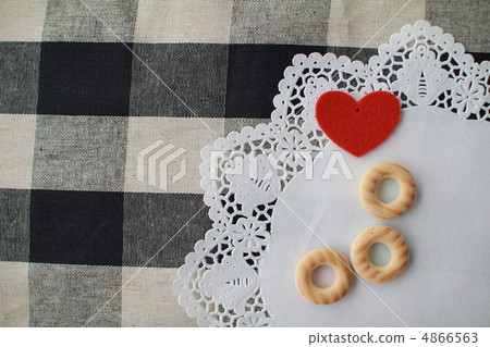 Biscuits and heart-shaped felt pieces arranged on a cloth Biscuits and heart-shaped felt pieces arranged on a cloth 4866563