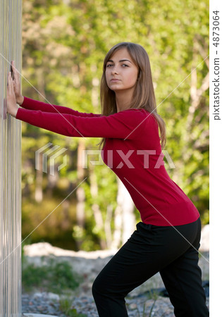 Beautiful girl in purple dress outside steel wall Beautiful girl in purple dress outside steel wall 4873064