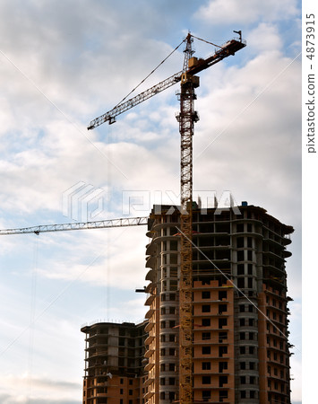 Stand, house, construction crane in the sky with clouds 4873915