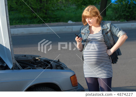 Pregnant Woman Calling for help near the Broken Car Pregnant Woman Calling for help near the Broken Car 4874227