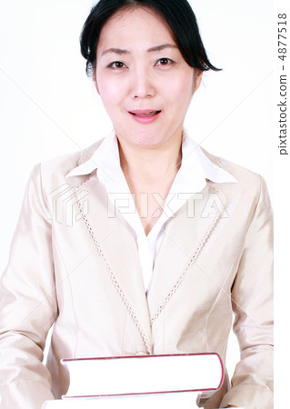 Business woman carrying a book Business woman carrying a book 4877518