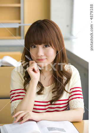 Female college studying at university library Female college studying at university library 4879188