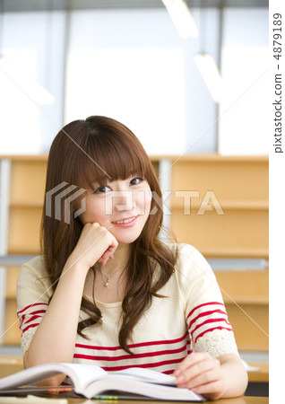 Female college studying at university library Female college studying at university library 4879189